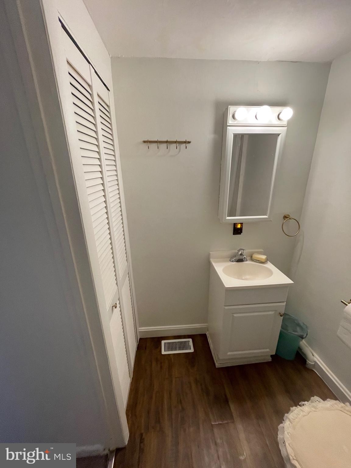 1841 Light Street Baltimore, MD 21230 - Photo 19 of 21 a bathroom with a sink and mirror