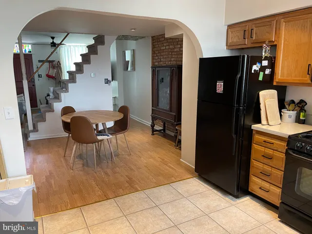 a living room with furniture and a dresser