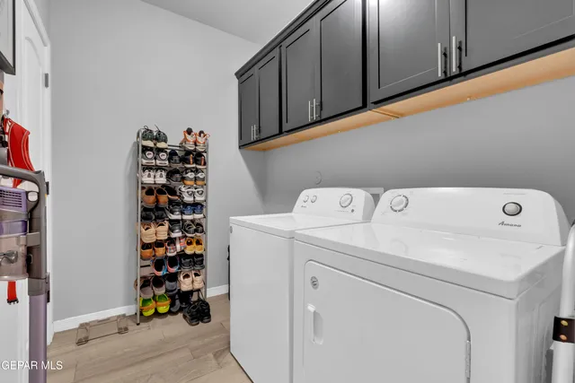 a bedroom with furniture and a flat screen tv