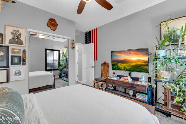 a kitchen with stainless steel appliances kitchen island granite countertop a refrigerator a sink a stove and island