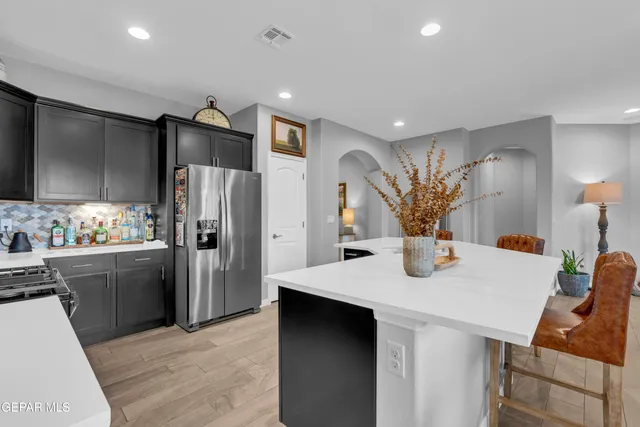 a view of a dining room with furniture and a potted plant