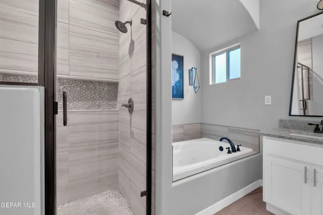 an aerial view of a house with a mountain