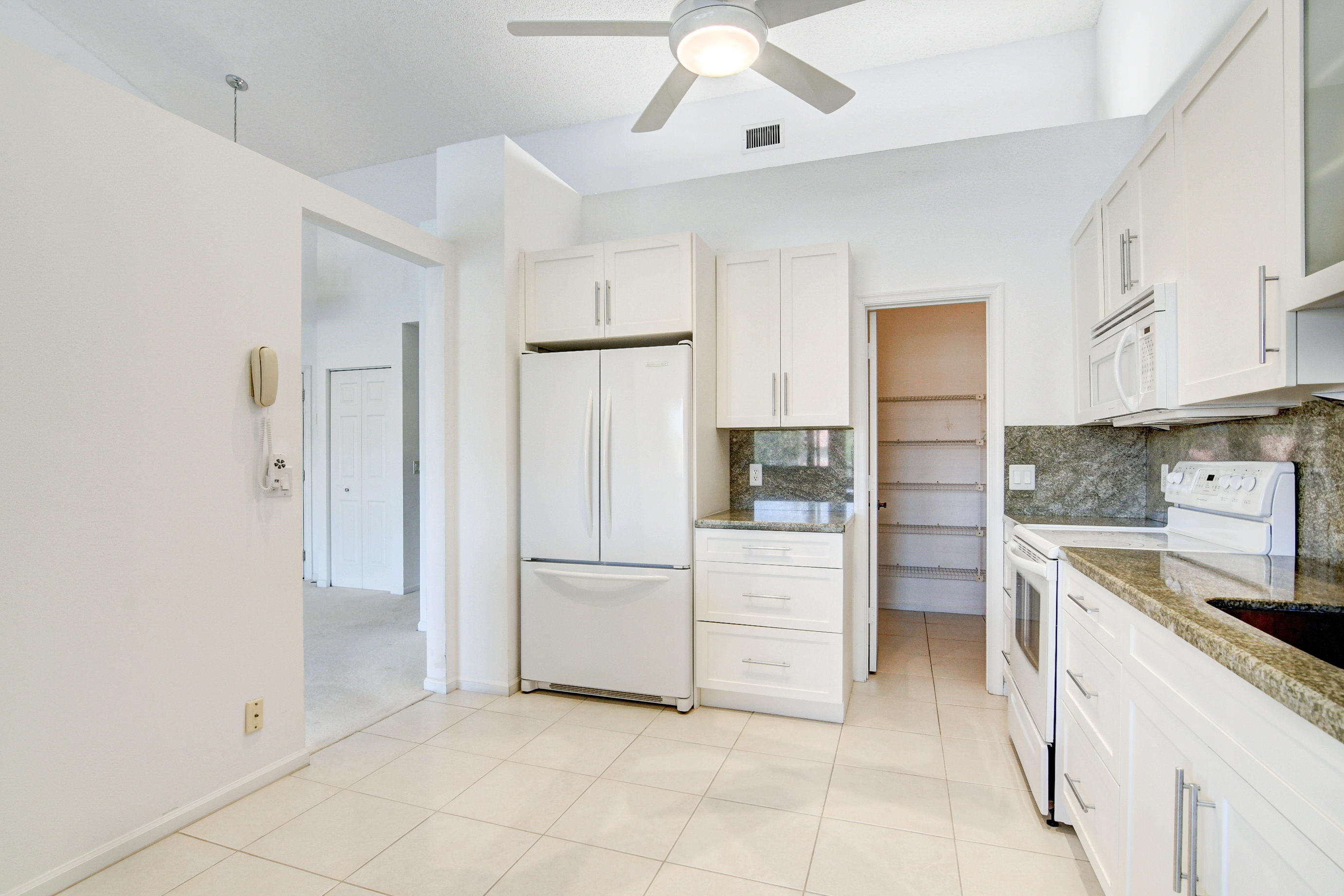 5771 Coach House Circle, Unit G Boca Raton, FL 33486 - Photo 12 of 72 White Kitchen