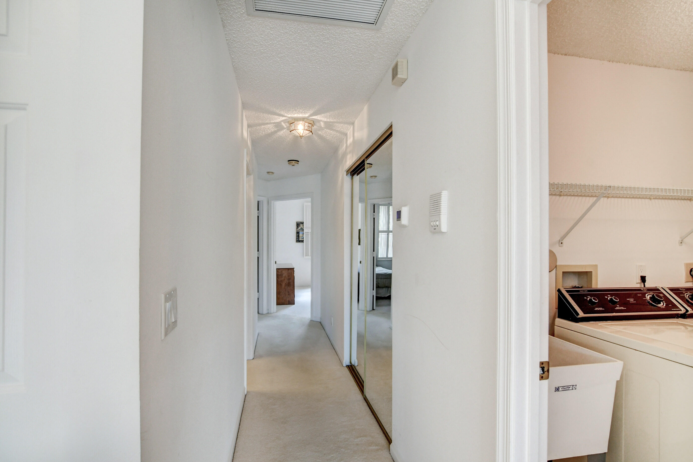 5771 Coach House Circle, Unit G Boca Raton, FL 33486 - Photo 36 of 72 Hallway to Bedrooms