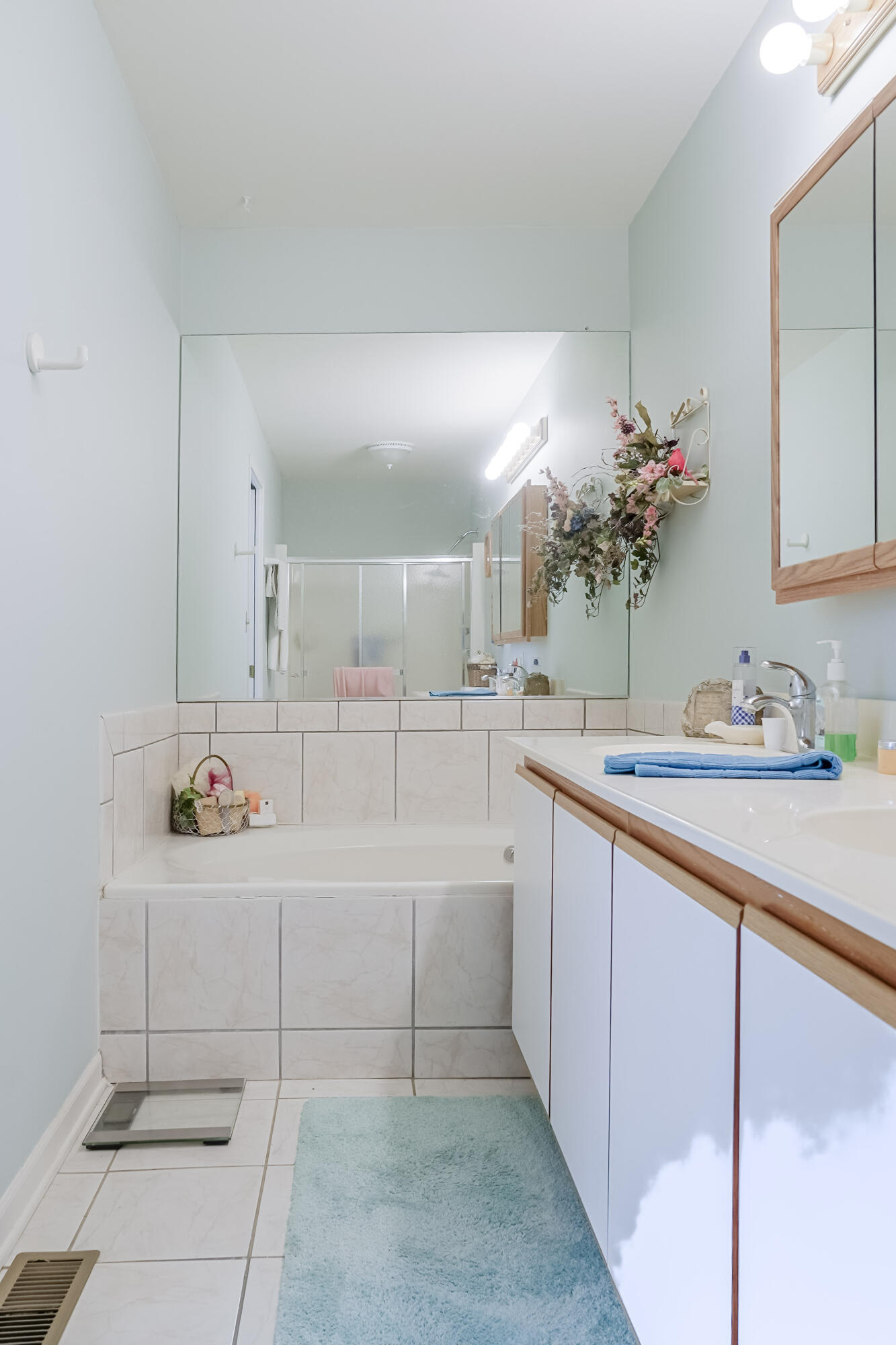 5065 Spinnaker Lane, Unit D Crown Point, IN 46307 - Photo 19 of 42 a bathroom with a double vanity sink mirror and shower