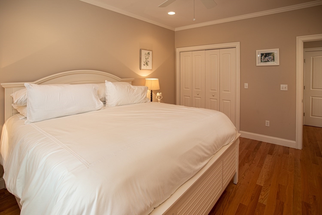 1346 Main Road, Unit B Westport, MA 02790 - Photo 18 of 29 a bedroom with a bed and a night stand