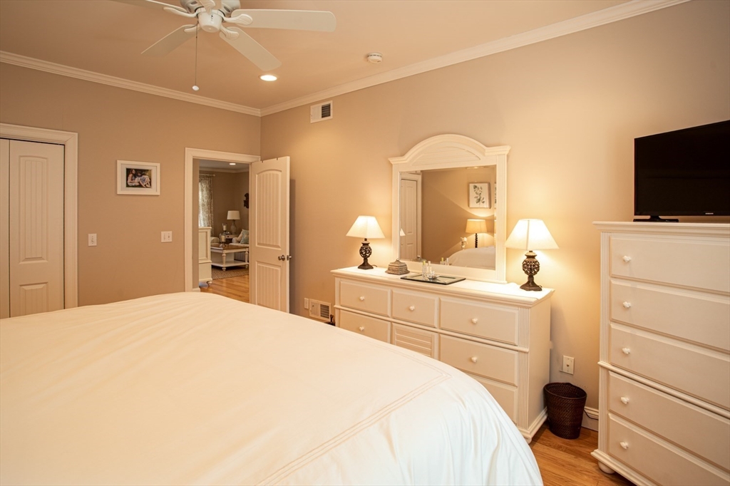 1346 Main Road, Unit B Westport, MA 02790 - Photo 19 of 29 a bedroom with a bed and a flat screen tv