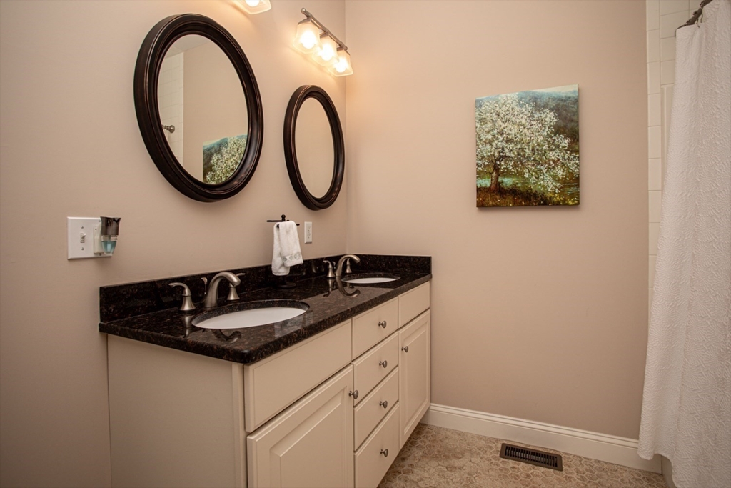 1346 Main Road, Unit B Westport, MA 02790 - Photo 20 of 29 a bathroom with a sink and a mirror