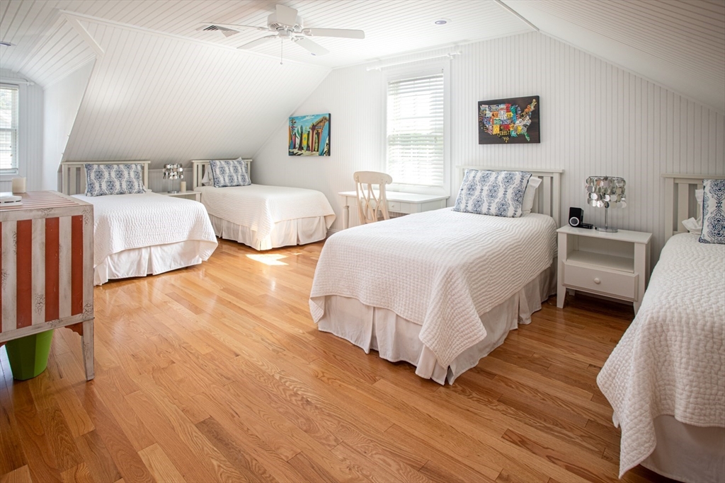1346 Main Road, Unit B Westport, MA 02790 - Photo 24 of 29 a bedroom with two beds and painting on the wall