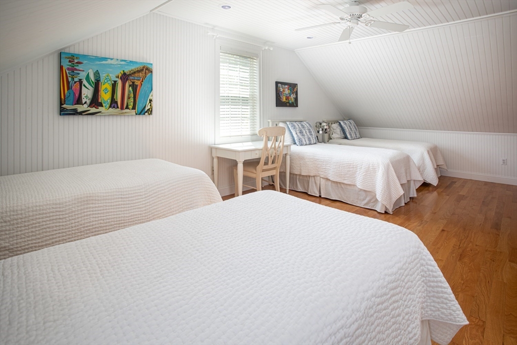 1346 Main Road, Unit B Westport, MA 02790 - Photo 25 of 29 a bedroom with two beds and a painting on the wall