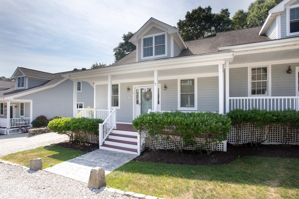 1346 Main Road, Unit B Westport, MA 02790 - Photo 3 of 29 front view of a house with a yard