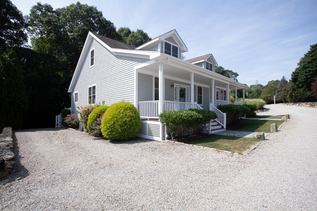 1346 Main Road, Unit B Westport, MA 02790 - Photo 4 of 29 a view of a house with backyard and garden