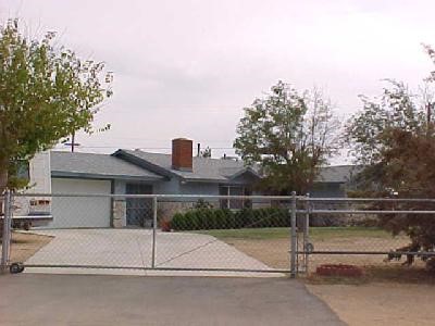 12515 Tonikan Road Apple Valley, CA 92308 - Photo 1 of 1 a view of a house with a street