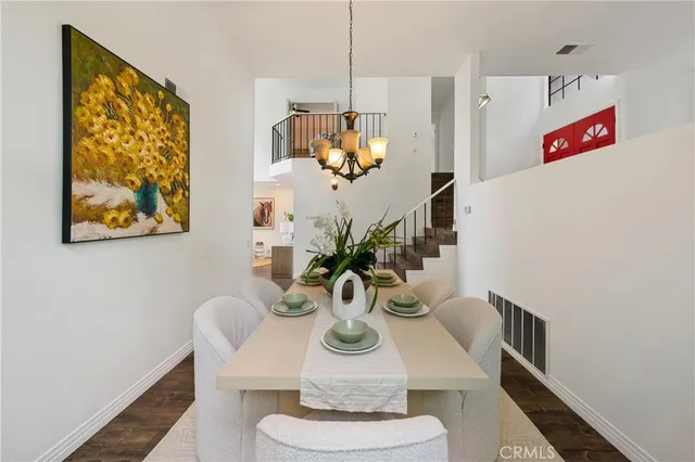 a living room with furniture flowerpot and a potted plant