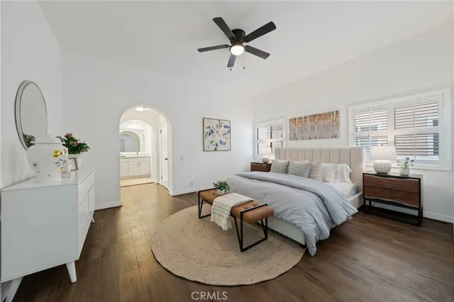 a bed room with a bed and a chandelier