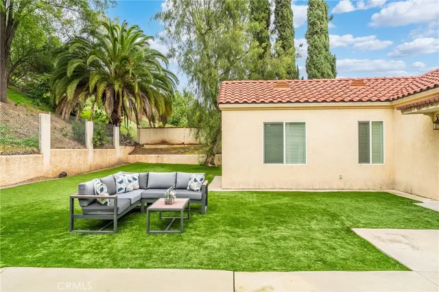 a view of a table and chairs in the garden
