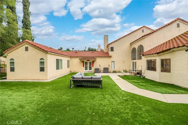 a view of a kitchen with stainless steel appliances refrigerator and microwave