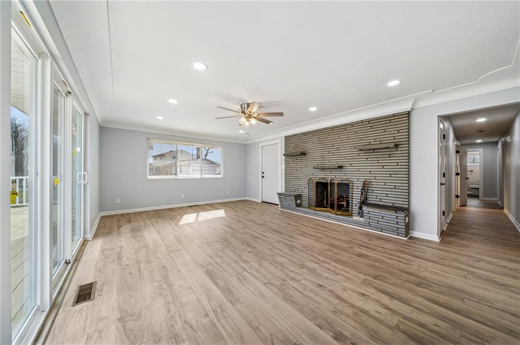 12305 Larimer Avenue Irwin, PA 15642 - Photo 11 of 39 LIVING ROOM (21X15) HAS SLIDING DOORS TO A WRAP AROUND DECK AND DOOR TO FRONT PORCH.