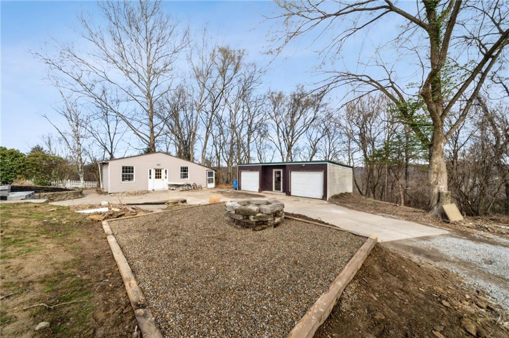 12305 Larimer Avenue Irwin, PA 15642 - Photo 34 of 39 OVERSIZED 2 DET/GRG AND HUGE SHED/HOBBY ROOM. NEW FIREPIT AREA. STAMPED CONCRETE DRIVE