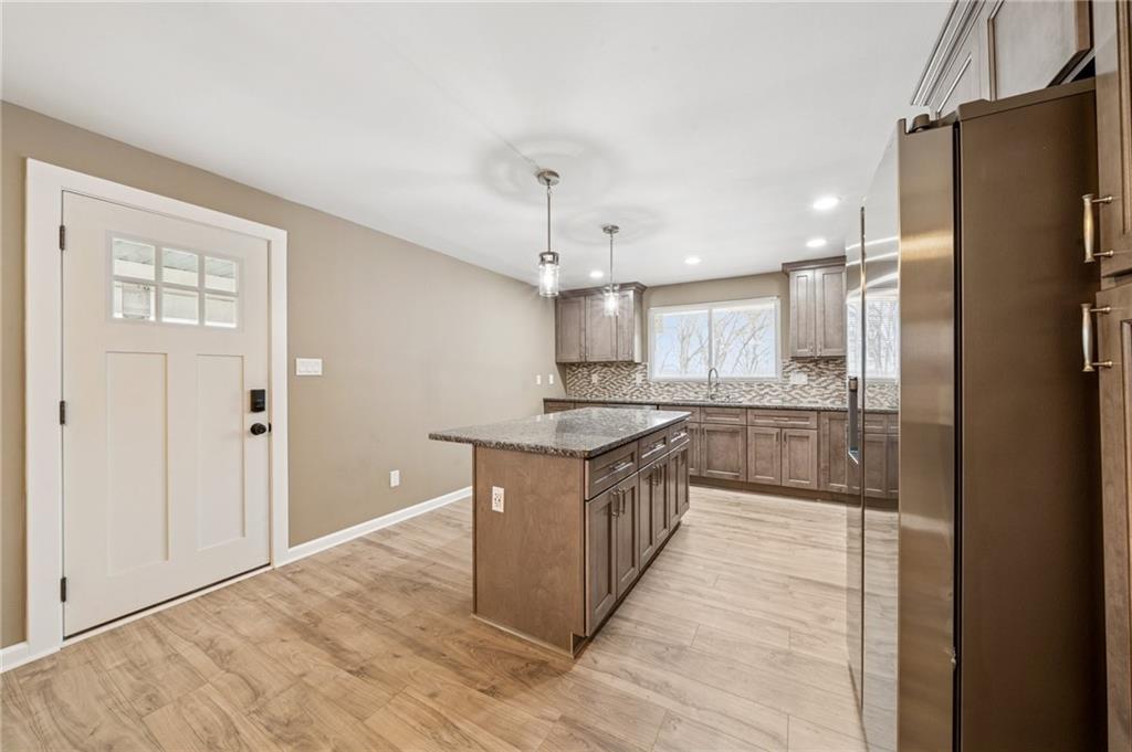 12305 Larimer Avenue Irwin, PA 15642 - Photo 6 of 39 NEW EXTERIOR DOOR OFF KITCHEN TO DECK AREA FOR EASY GRILLING ACCESS.