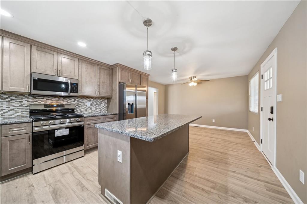 12305 Larimer Avenue Irwin, PA 15642 - Photo 9 of 39 SOFT CLOSE CABINETS/NEW FLOORS/LIGHT FIXTURES/ETC.