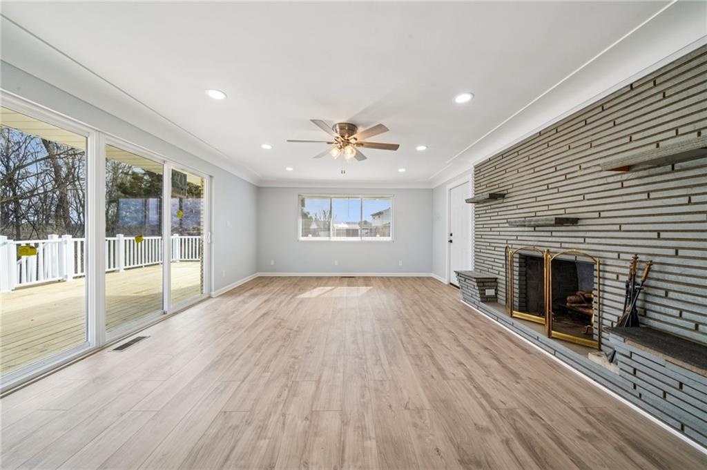12305 Larimer Avenue Irwin, PA 15642 - Photo 10 of 39 BIGGER THAN IT LOOKS. LARGE DOORS AND WINDOWS ALLOWING PLENTY OF NATURAL SUNLIGHT TO ENTER HOME.