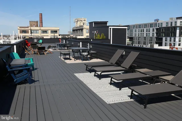 a view of a balcony with chairs