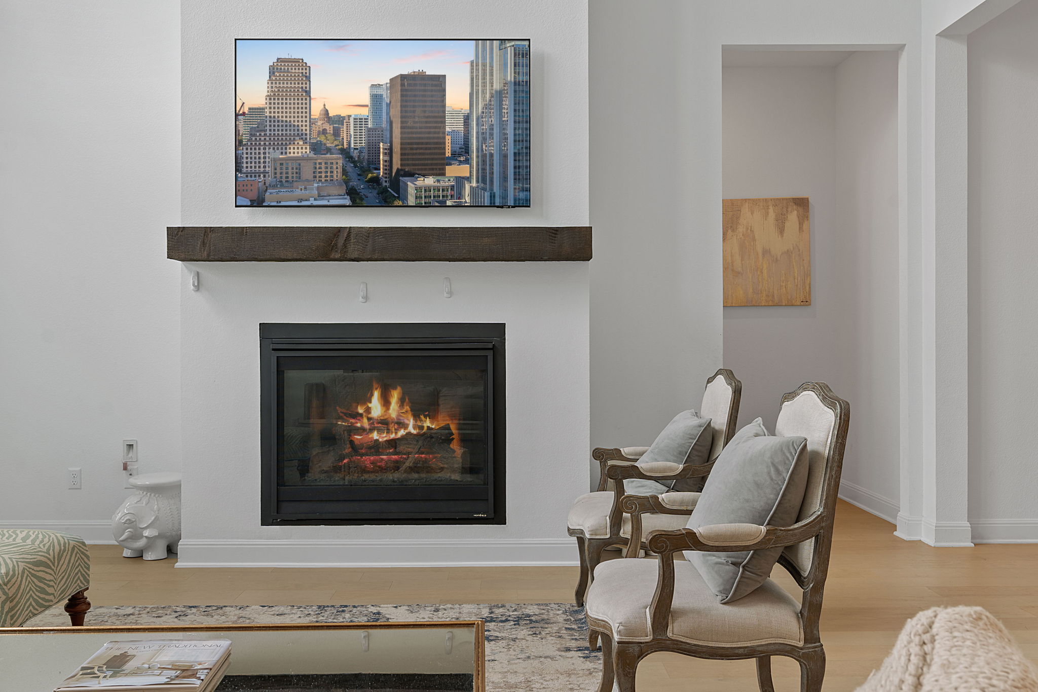 309 Pear Tree Lane Austin, TX 78737 - Photo 7 of 39 a living room with furniture a fireplace and wall paintings