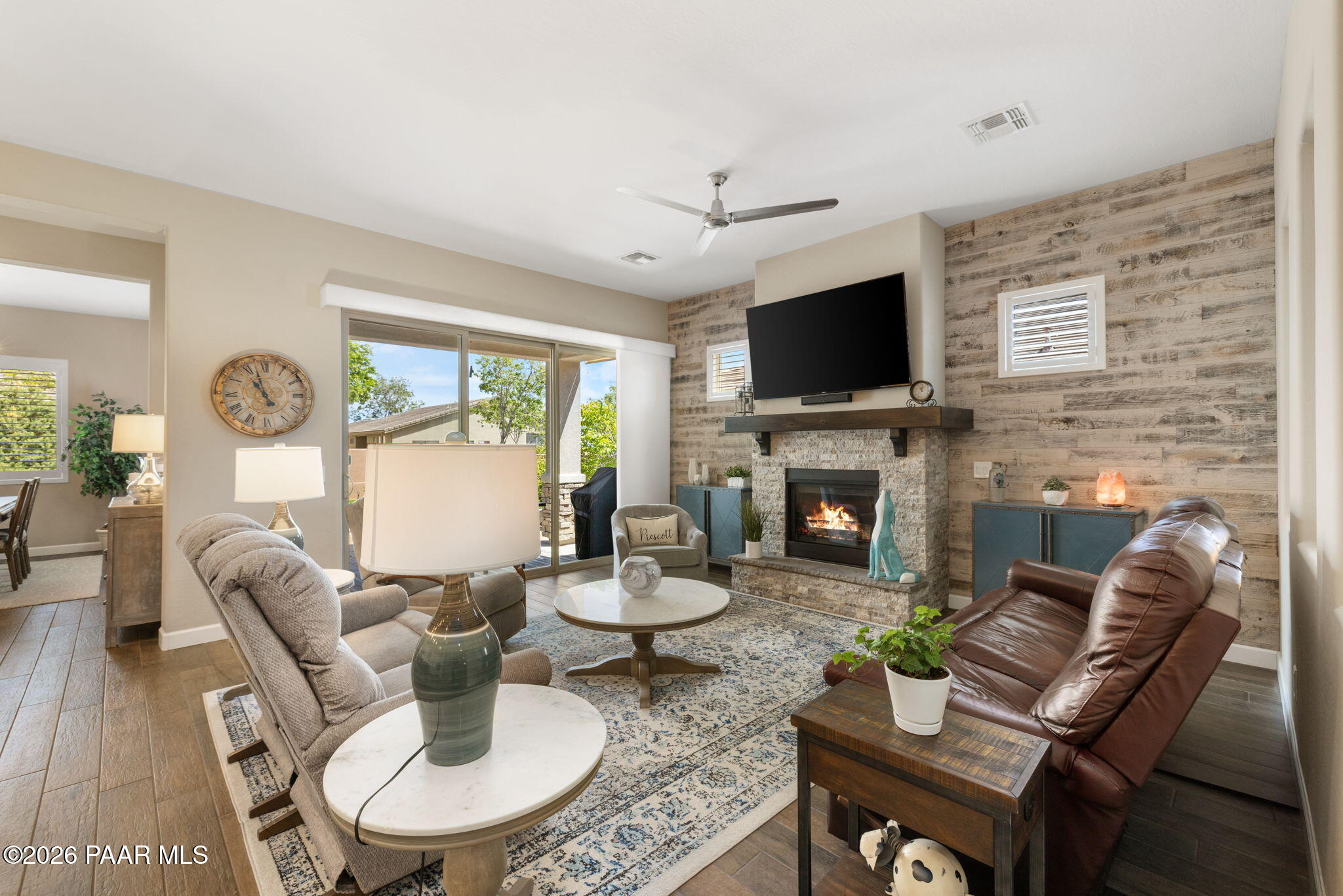 2792 Brooks Range Prescott, AZ 86301 - Photo 15 of 35 a living room with furniture a flat screen tv and a fireplace