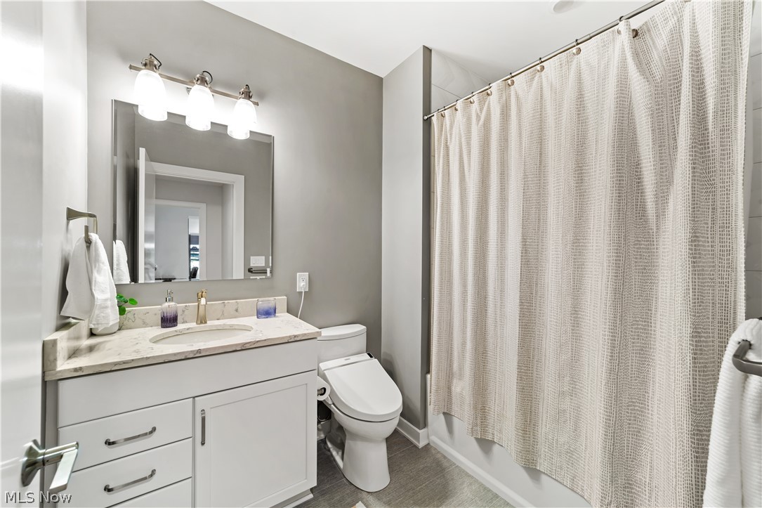 2044 Random Road, Unit 101 Cleveland, OH 44106 - Photo 27 of 44 Full bathroom featuring shower / tub combo, toilet, and vanity
