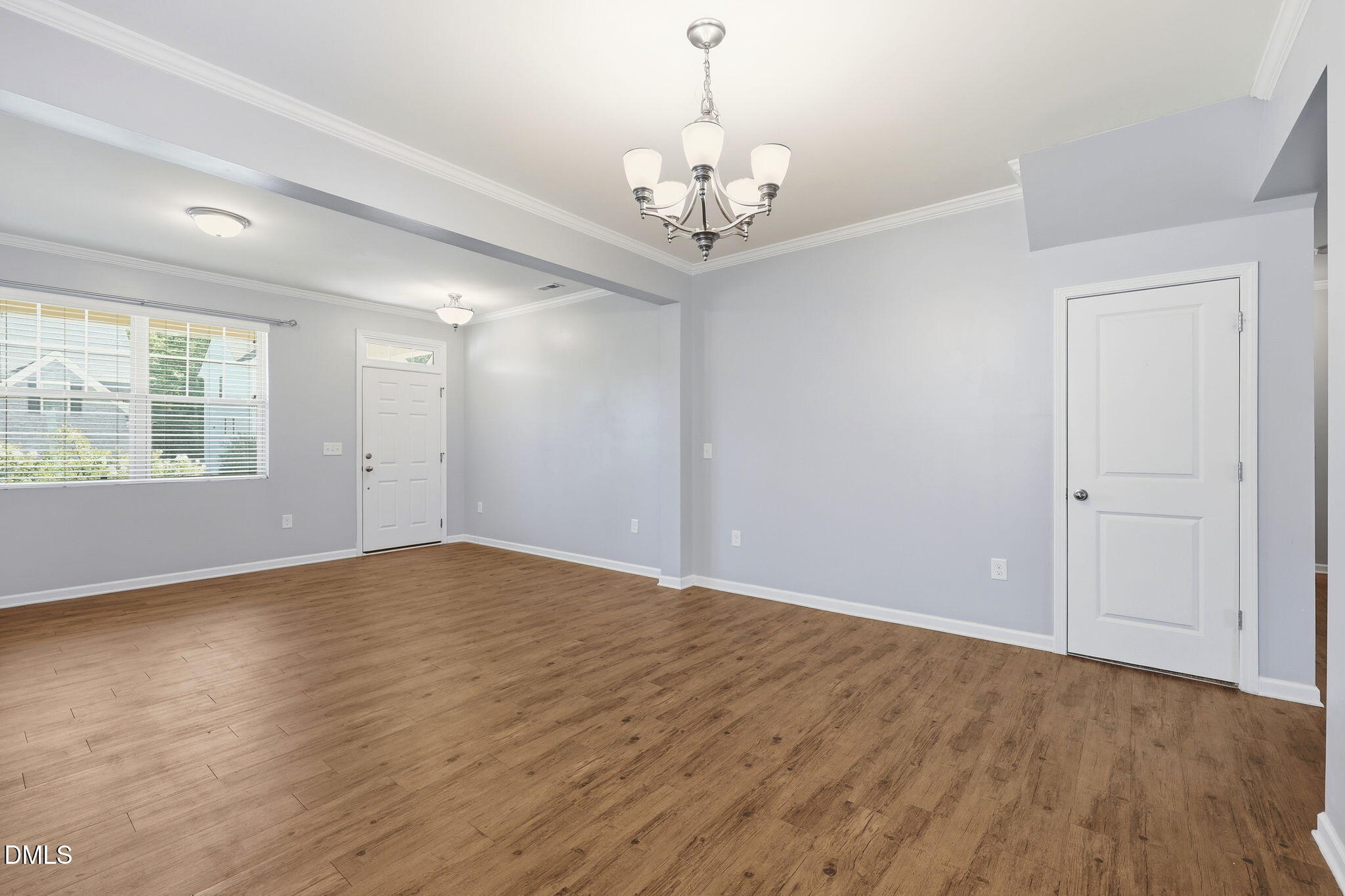 1808 Austin Rdg Parkway Wake Forest, NC 27587 - Photo 11 of 57 a view of an empty room with wooden floor and a window