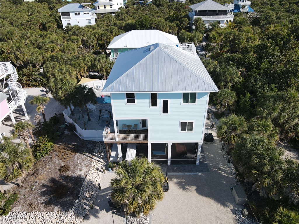 4500 Butterfly Shell Drive Captiva, FL 33924 - Photo 2 of 42 a aerial view of a house with yard and sitting area