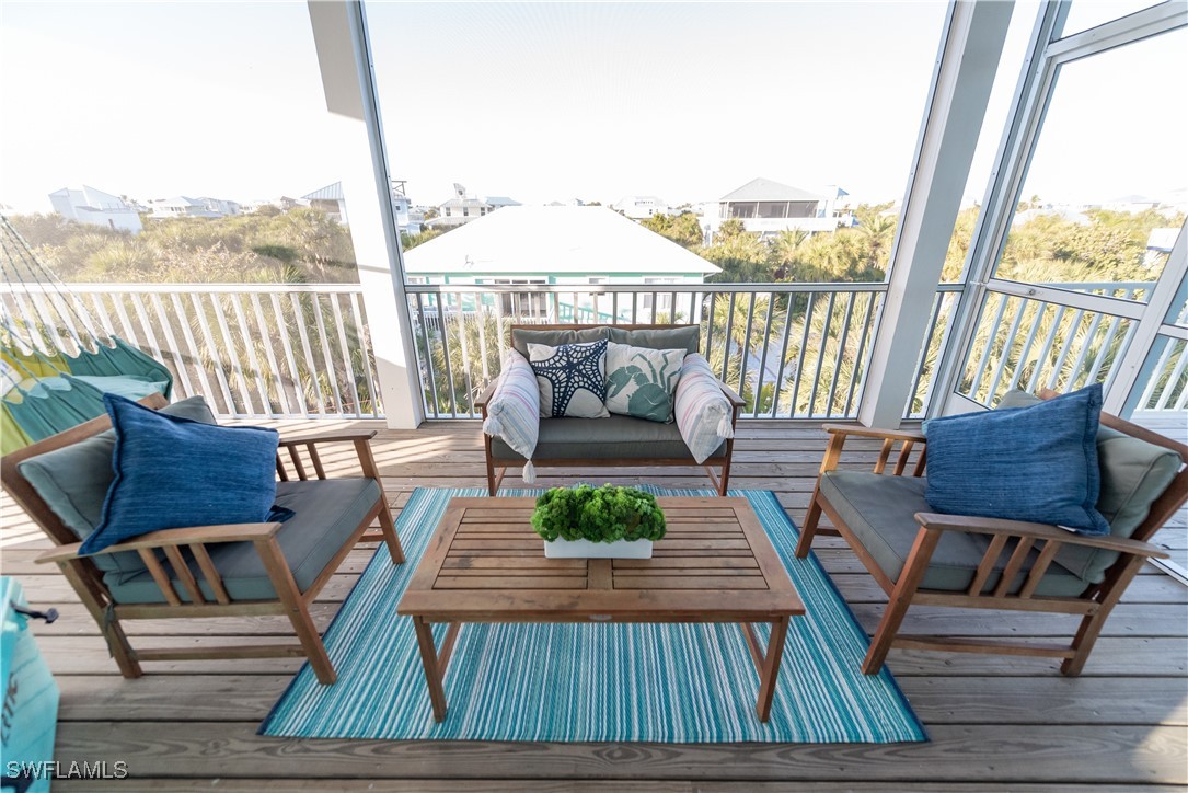 4500 Butterfly Shell Drive Captiva, FL 33924 - Photo 22 of 42 a outdoor living room with furniture