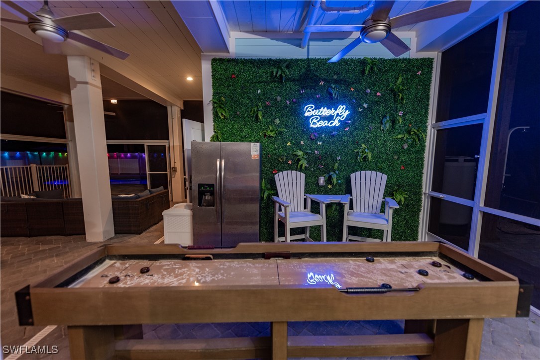 4500 Butterfly Shell Drive Captiva, FL 33924 - Photo 29 of 42 a kitchen with stainless steel appliances granite countertop a sink and cabinets
