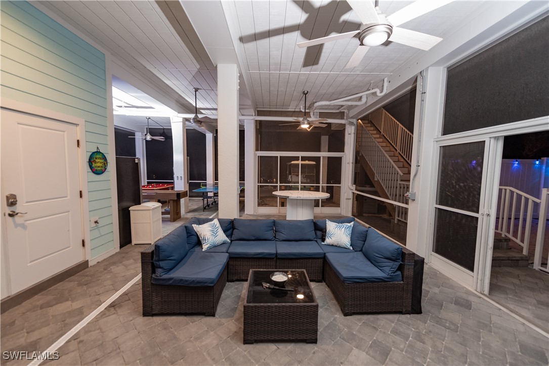 4500 Butterfly Shell Drive Captiva, FL 33924 - Photo 30 of 42 a living room with furniture and a chandelier