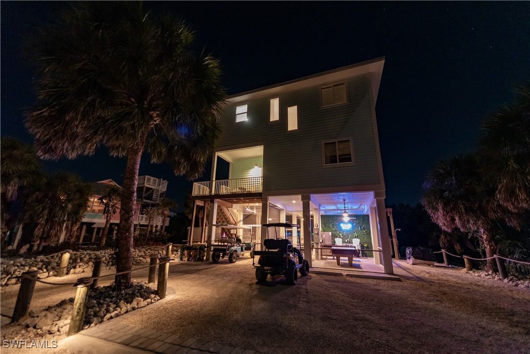 4500 Butterfly Shell Drive Captiva, FL 33924 - Photo 31 of 42 a view of a building with a patio