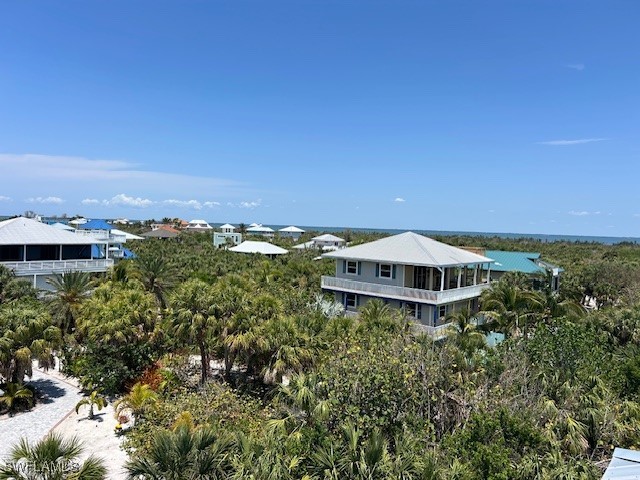 4500 Butterfly Shell Drive Captiva, FL 33924 - Photo 42 of 42 an aerial view of a house with a yard and lake view