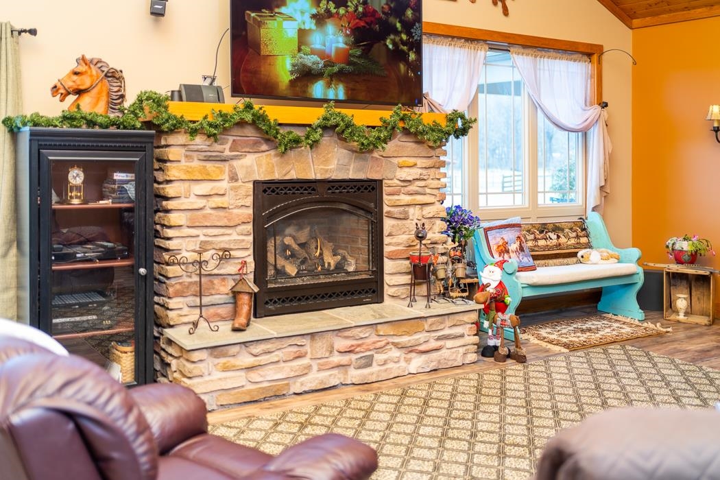 2564 Mt Torrey Road Lyndhurst, VA 22952 - Photo 19 of 64 a living room with furniture and a fireplace