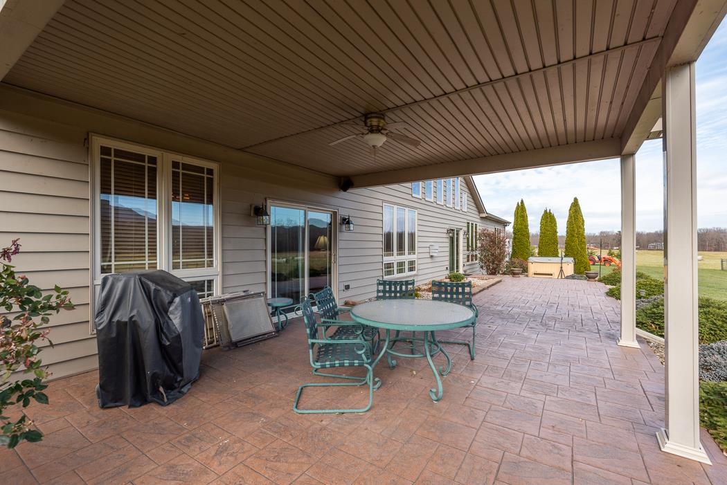 2564 Mt Torrey Road Lyndhurst, VA 22952 - Photo 8 of 64 a view of a patio with a table and chairs and a barbeque