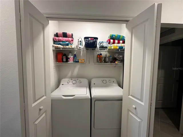 a utility room with dryer and washer