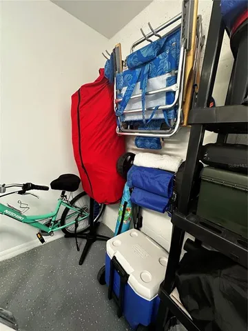 a front view of a house with garden and trees