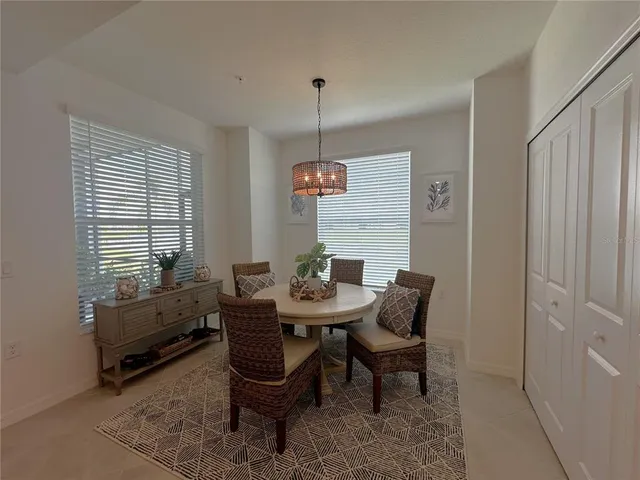 a dining room with furniture and window