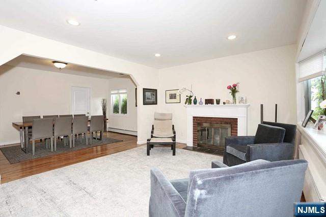 84 12th Street Cresskill, NJ 07626 - Photo 5 of 45 a living room with furniture and a fireplace