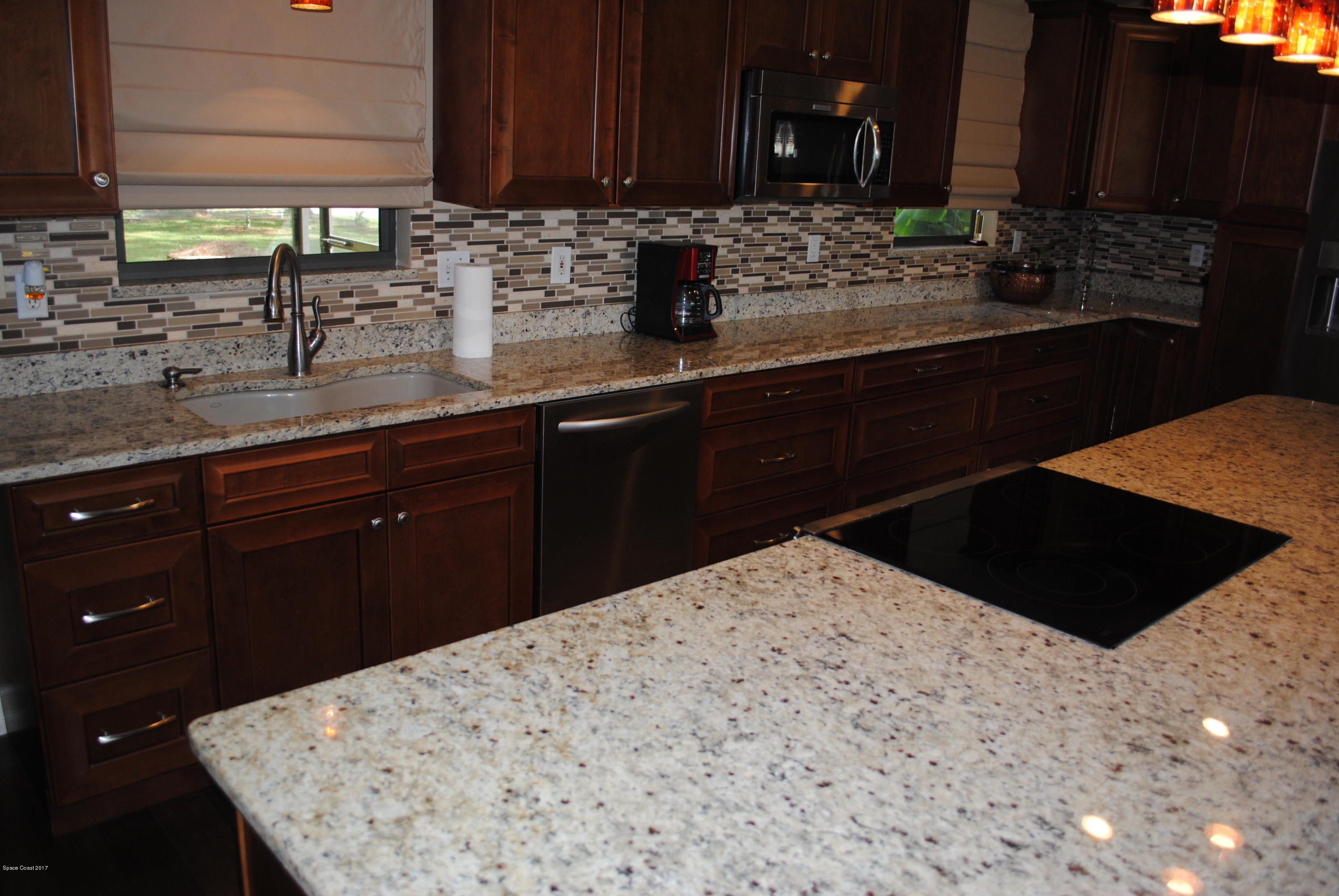 399 Warner Road Southwest Palm Bay, FL 32908 - Photo 2 of 40 a kitchen with a sink and a cabinets