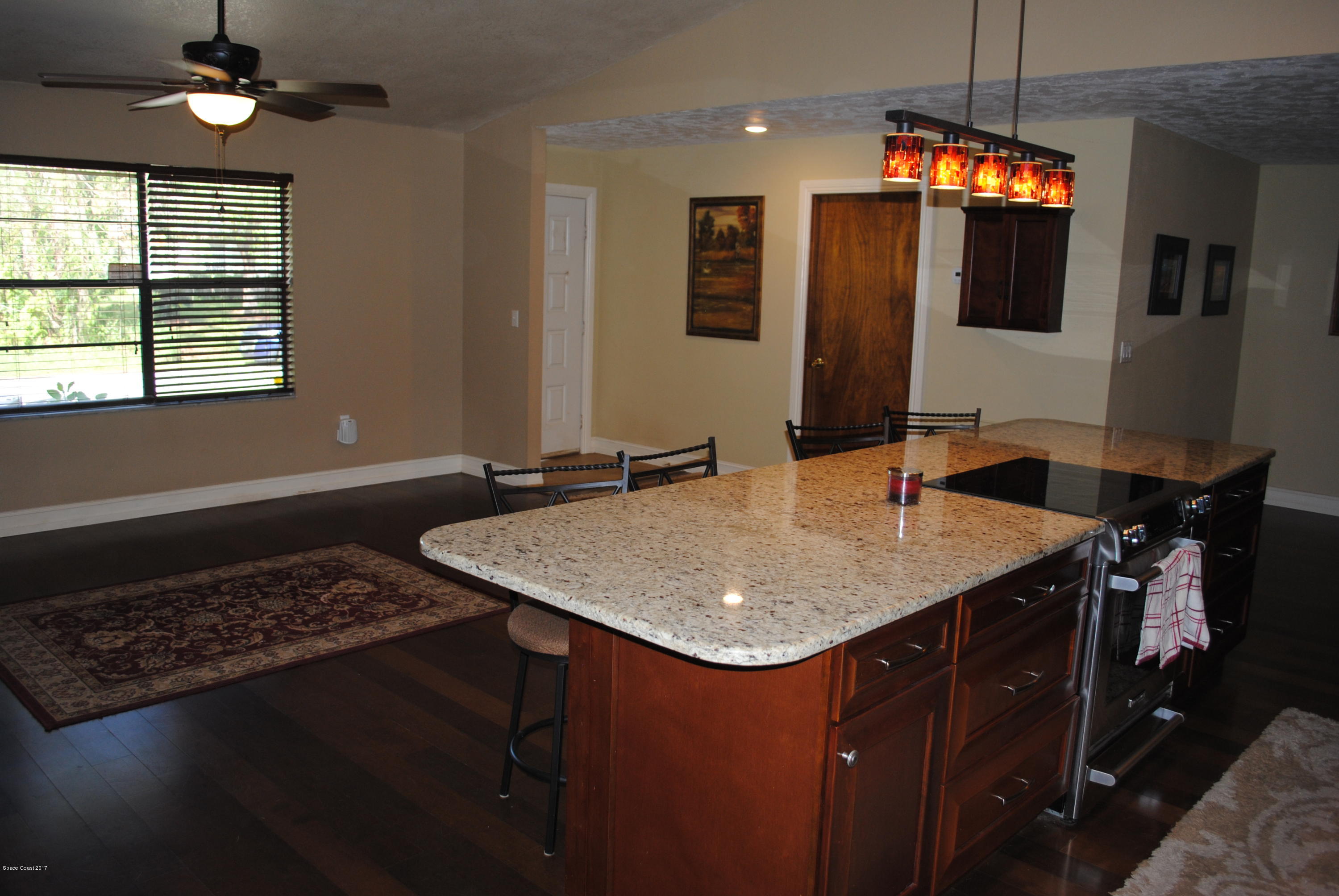 399 Warner Road Southwest Palm Bay, FL 32908 - Photo 11 of 40 a bathroom with a granite countertop sink and a mirror