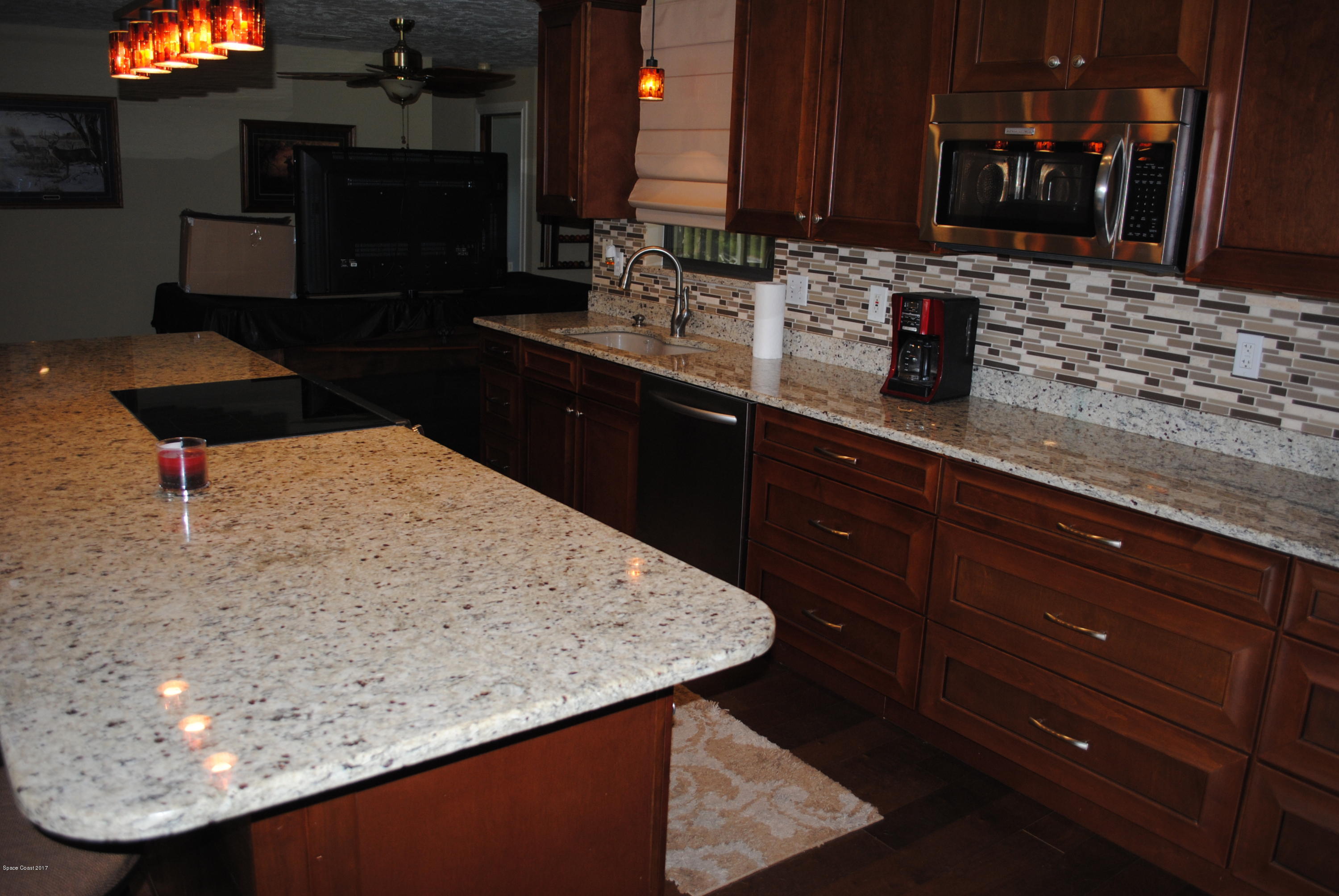 399 Warner Road Southwest Palm Bay, FL 32908 - Photo 4 of 40 a kitchen with a sink and cabinets