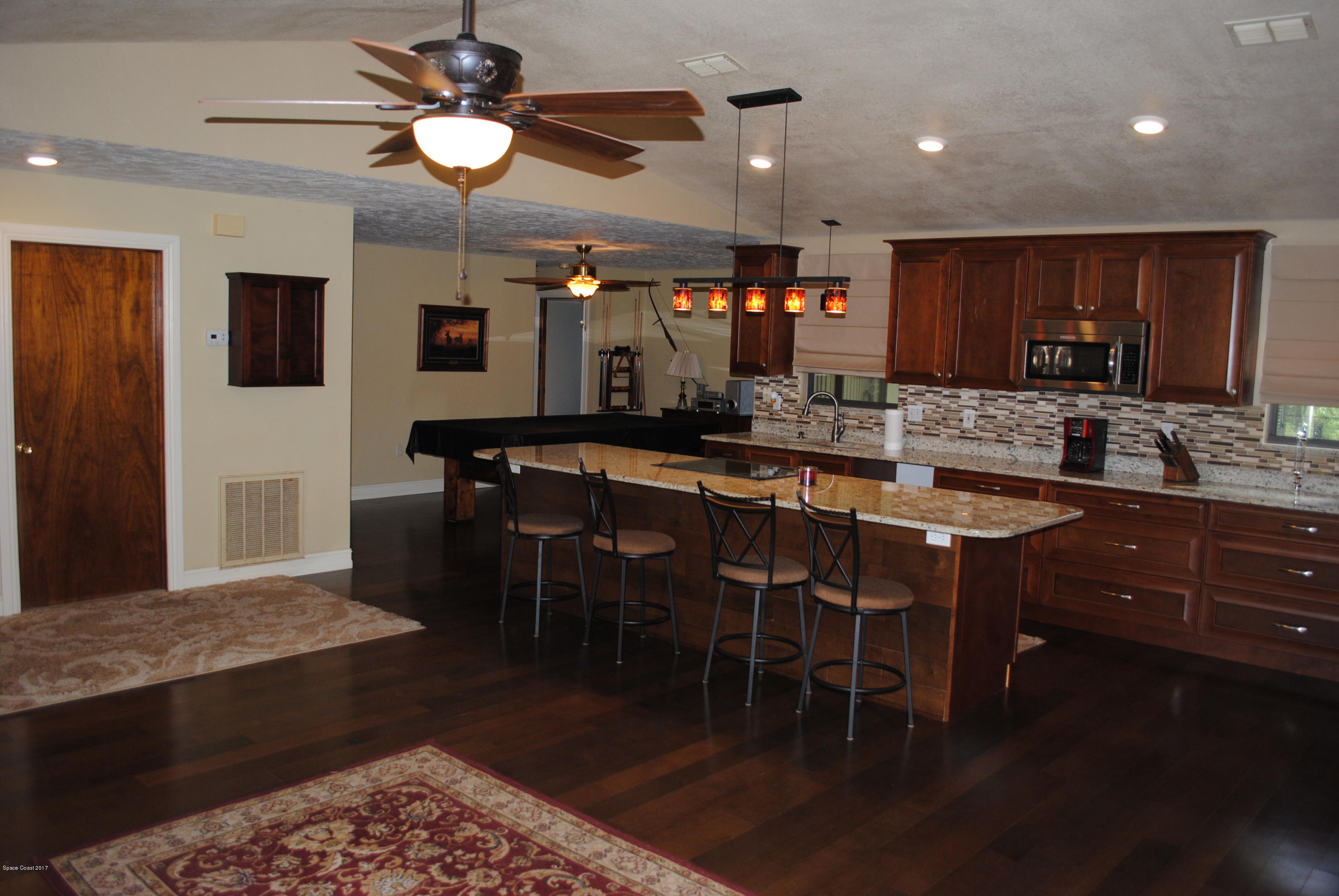 399 Warner Road Southwest Palm Bay, FL 32908 - Photo 6 of 40 a kitchen with a table and chairs in it