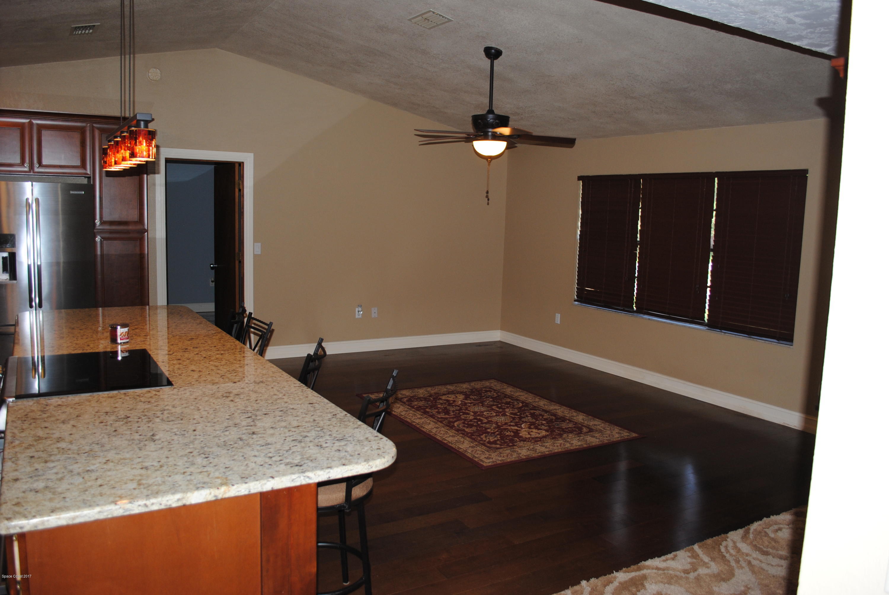 399 Warner Road Southwest Palm Bay, FL 32908 - Photo 10 of 40 a bathroom with a granite countertop sink and a mirror