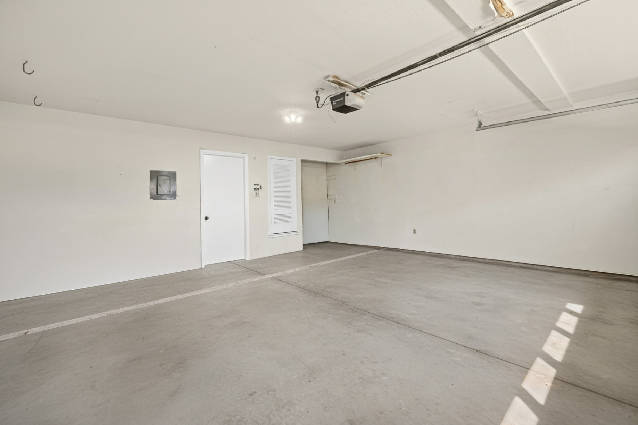 1010 West Rundberg Lane, Unit 30 Austin, TX 78758 - Photo 15 of 30 an empty room with ceiling fan and windows