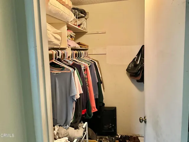 a bedroom with a bed and a fireplace